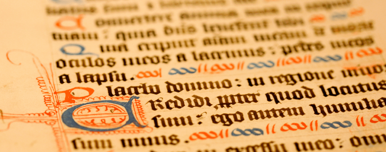 A close up of the letters in an old book